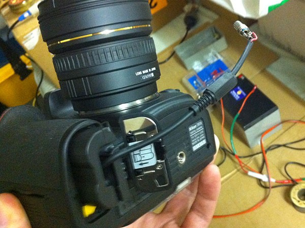 The EP-5B hanging out of the D800's battery slot